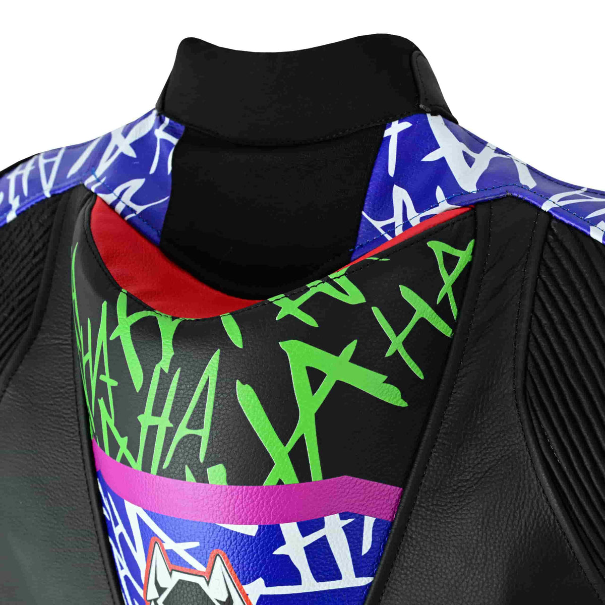 Rider wearing Joker purple and green leather motorcycle suit in a racing riding position